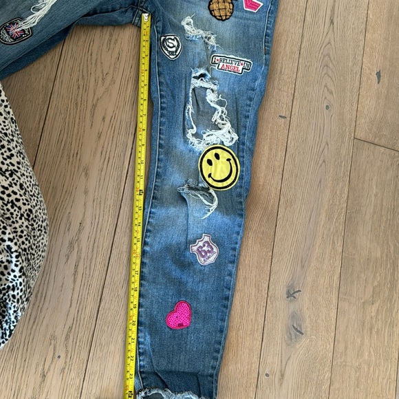 The cutest assorted patched jeans. Jeans have designer made holes for style. - Picture 4 of 5